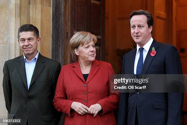 British Prime Minster David Cameron greets the German Chancellor Angela Merkel and her husband Joachim Sauer outside Chequers, the Prime Minister's...