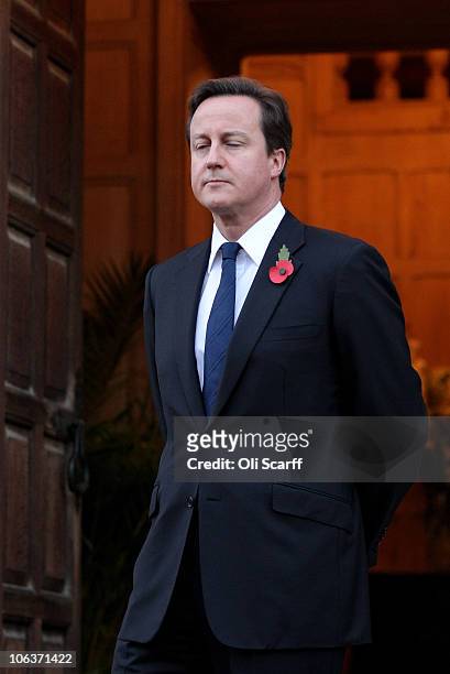 British Prime Minster David Cameron waits to greet the German Chancellor Angela Merkel outside Chequers, the Prime Minister's country residence on...