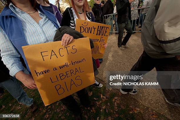 People gather on the National Mall in Washington, DC, on October 30, 2010 for television satirists Jon Stewart's and Stephen Colbert's Rally to...