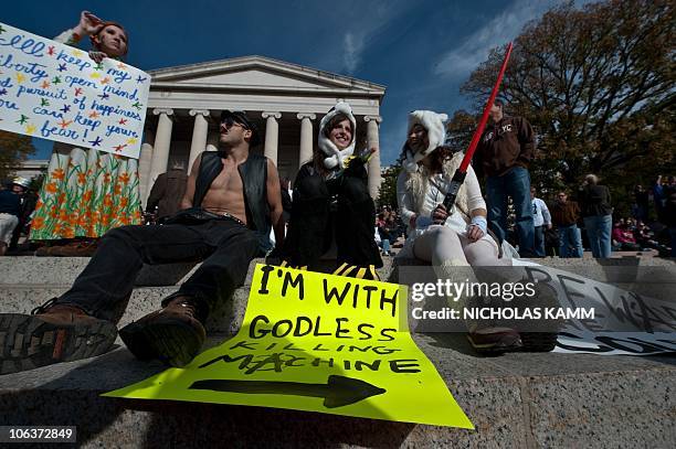 People gather on the National Mall in Washington, DC, on October 30, 2010 for television satirists Jon Stewart's and Stephen Colbert's Rally to...