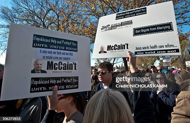 People gather on the National Mall in Washington, DC, on October 30, 2010 for television satirists Jon Stewart's and Stephen Colbert's Rally to...