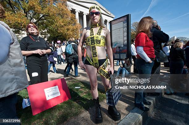 People gather on the National Mall in Washington, DC, on October 30, 2010 for television satirists Jon Stewart's and Stephen Colbert's Rally to...