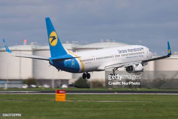 Ukraine International Airlines Boeing 737-900ER landing at Amsterdam Schiphol International Airport in The Netherlands. The aircraft registration is...