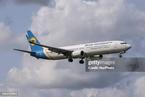 Ukraine International Airlines Boeing 737-900ER landing at Amsterdam Schiphol International Airport in The Netherlands. The aircraft registration is...