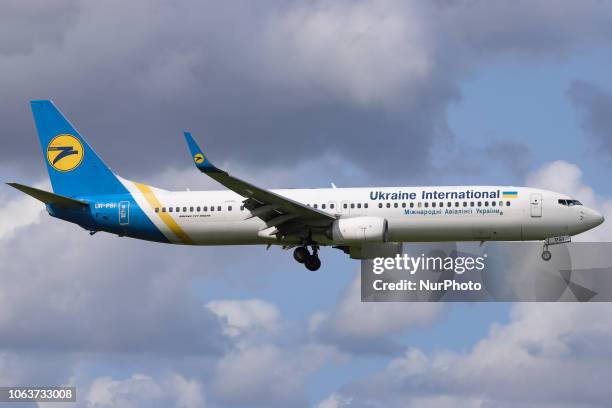 Ukraine International Airlines Boeing 737-900ER landing at Amsterdam Schiphol International Airport in The Netherlands. The aircraft registration is...