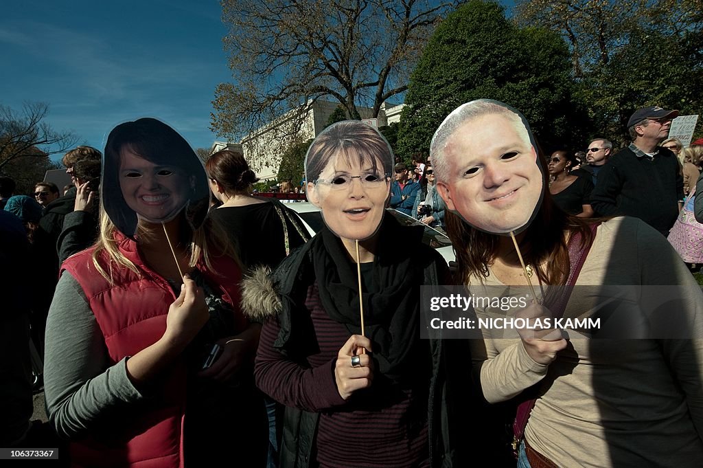 People wear masks of Delaware senatorial