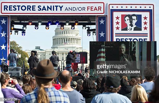 People gather on the National Mall in Washington, DC, on October 30, 2010 for television satirists Jon Stewart's and Stephen Colbert's Rally to...
