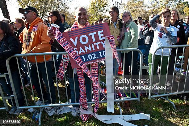 People gather on the National Mall in Washington, DC, on October 30, 2010 for television satirists Jon Stewart's and Stephen Colbert's Rally to...