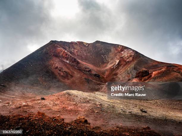 colourful crater at the summit of the etna volcano in sicily, italy - etna orange stockfoto's en -beelden