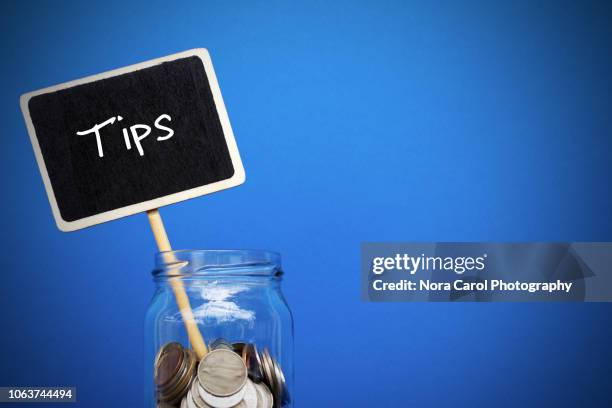 tips coins jar - gratuity stock pictures, royalty-free photos & images