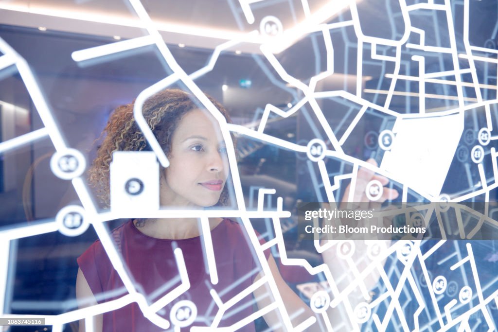 Woman operating digital interface technology