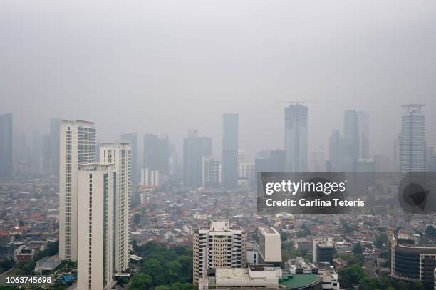 downtown jakarta city scape in heavy pollution - jakarta empty stock pictures, royalty-free photos & images