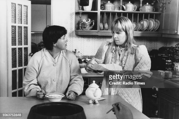 Actresses Pauline Quirke and Linda Robson in a kitchen scene from the 'Birds of a Feather' episode 'Just Visiting', September 30th 1989.