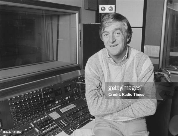 Portrait of broadcaster Michael Parkinson, sitting in the radio studio after being announced as the new presenter of 'Desert Island Discs', November...