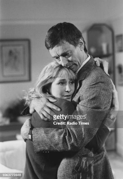 Actors Felicity Kendal and Peter McEnery embracing in a scene from the television series 'The Mistress', September 27th 1986.
