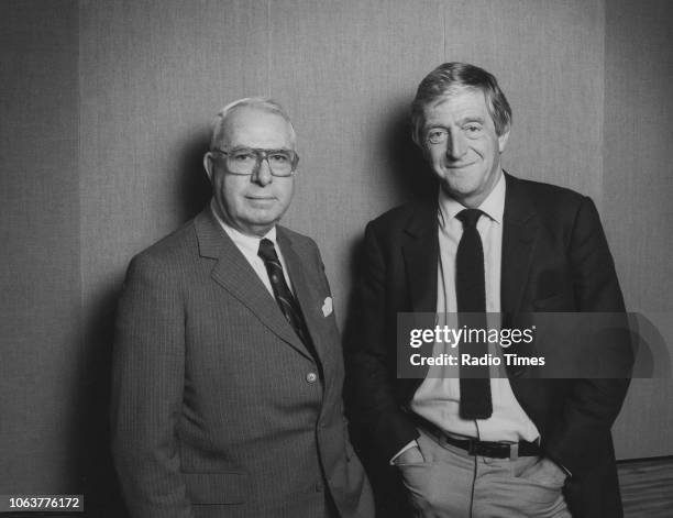 Presenter Michael Parkinson pictured with his guest, industrialist Ian McGregor, in connection with the BBC Radio 4 show 'Desert Island Discs', 1986.