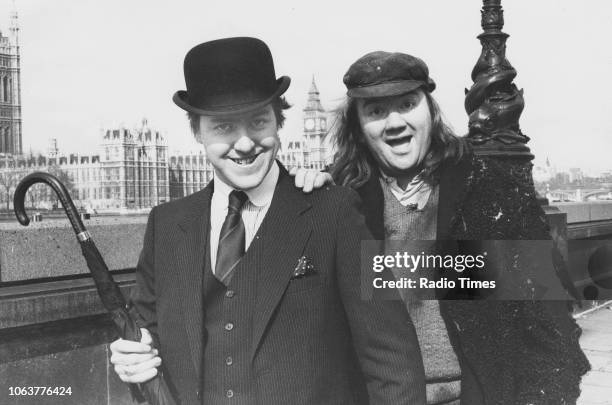 Actors Griff Rhys Jones and Mel Smith in costume next to the Houses of Parliament, photographed for Radio Times in connection with the television...