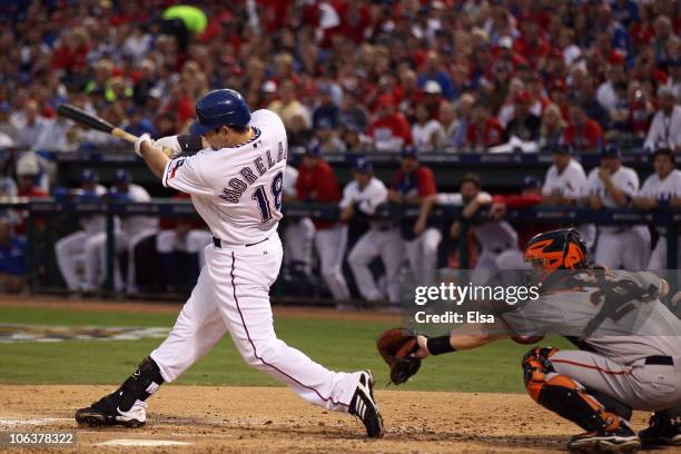 Mitch Moreland of the Texas Rangers hits a 3-run home run in the bottom of the second inning against the San Francisco Giants in Game Three of the...