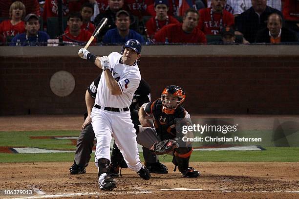 Mitch Moreland of the Texas Rangers hits a 3-run home run in the bottom of the second inning against the San Francisco Giants in Game Three of the...
