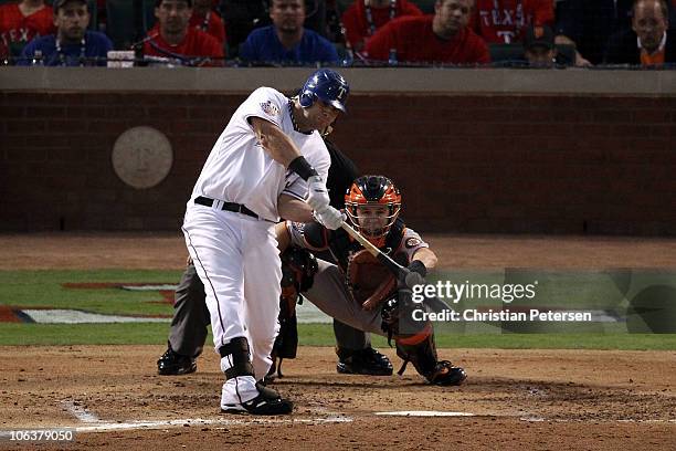 Mitch Moreland of the Texas Rangers hits a 3-run home run in the bottom of the second inning against the San Francisco Giants in Game Three of the...