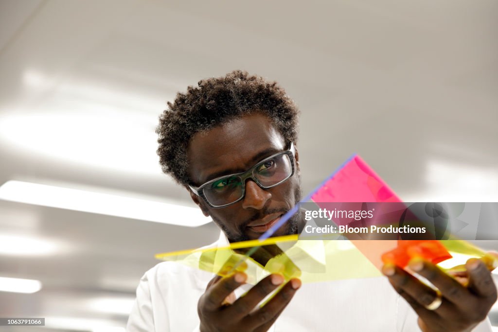 Designer examining a prototype