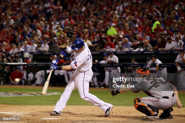 Josh Hamilton of the Texas Rangers hits a solo home run in the bottom of the fifht inning against the San Francisco Giants in Game Three of the 2010...