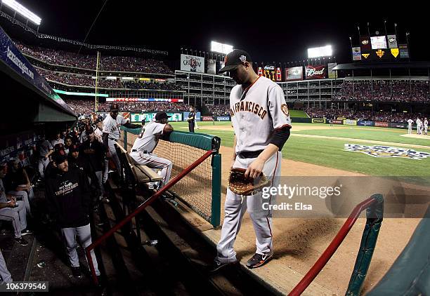 Starting pitcher Jonathan Sanchez of the San Francisco Giants walks into the dugout dejected after he was taken out of the game in the bottom of the...