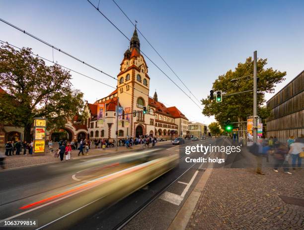 congress hall, the former society house of the zoo, ballroom, bell tower and tramway in augustusplatz, leipzig, germany - leipzig stock pictures, royalty-free photos & images