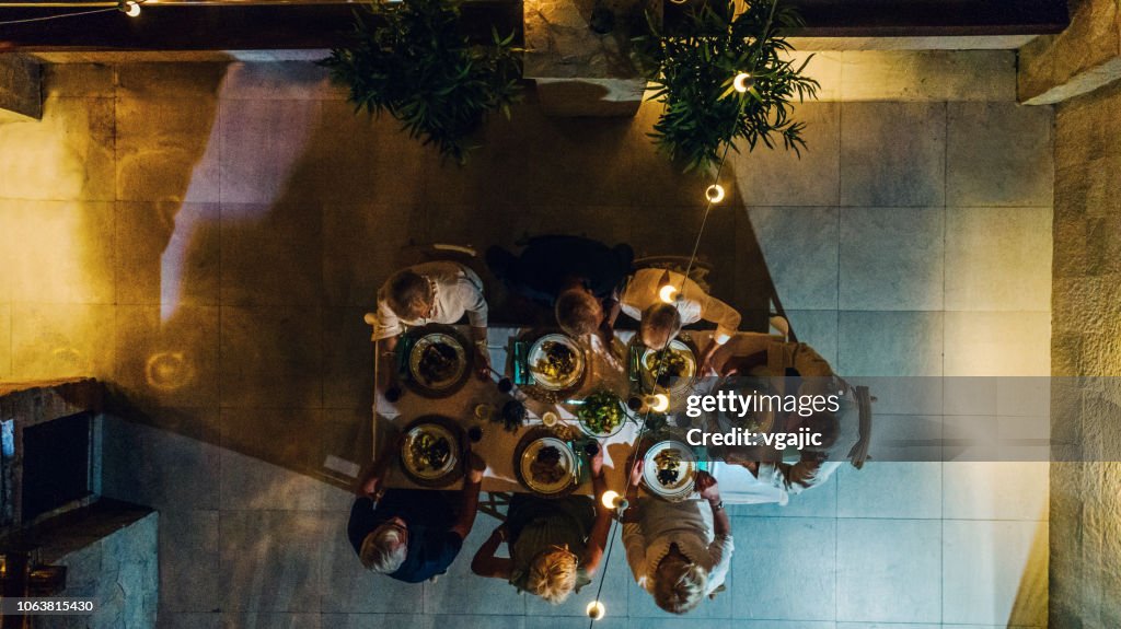Seniors Having Dinner On Rooftop