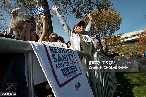 People attend television satirists Jon Stewart and Stephen Colbert's Rally to Restore Sanity and/or Fear on the National Mall in Washington on...