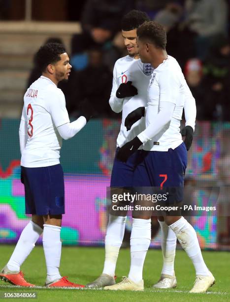 England U21's Dominic Solanke celebrates scoring his side's second goal of the game with team-mates during the international friendly match at the...