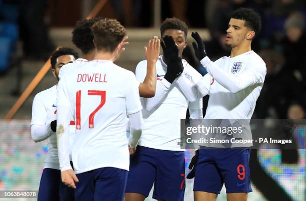 England U21's Dominic Solanke celebrates scoring his side's second goal of the game with team-mates during the international friendly match at the...