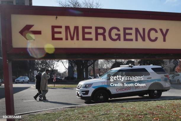 Police vehicle sits outside of Mercy Hospital where four people were shot and killed yesterday on November 20, 2018 in Chicago, Illinois. Chicago...