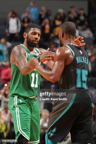 Kyrie Irving of the Boston Celtics shake hands with Kemba Walker of the Charlotte Hornets on November 19, 2018 at Spectrum Center in Charlotte, North...