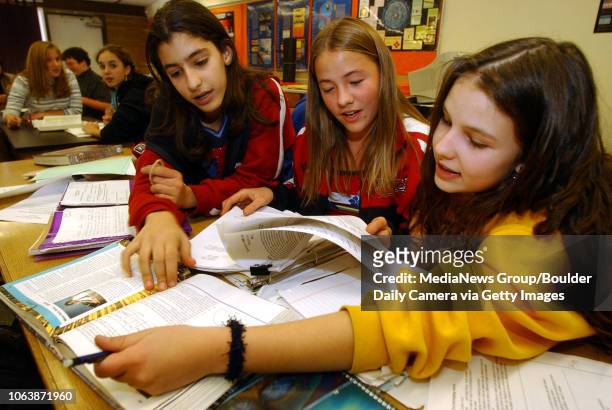 Delora Abedzadeh, left, Elizabeth Fleagle, and Rachel Robinson work as a science team at Summit Middle School on Thursday.The US Department of...