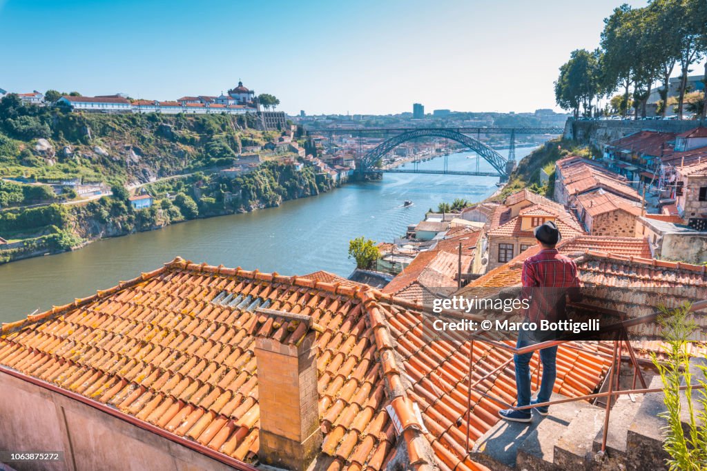 Tourist admiring Porto and Dom Luis I bridge