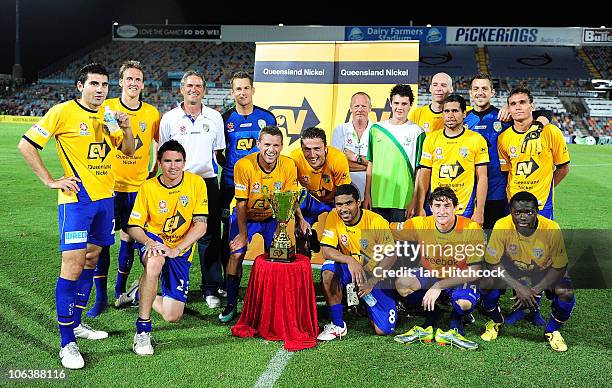 Gold Coast United pose with the Queensland Nickel Cup after winning the round 12 A-League match between the North Queensland Fury and Gold Coast...