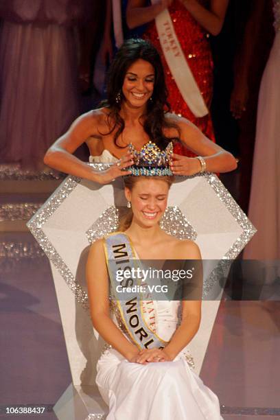 Miss World 2010 Alexandria Mills of the United States is crowned by the 59th Miss World Kaiane Aldorino after winning the 60th Miss World Beauty...