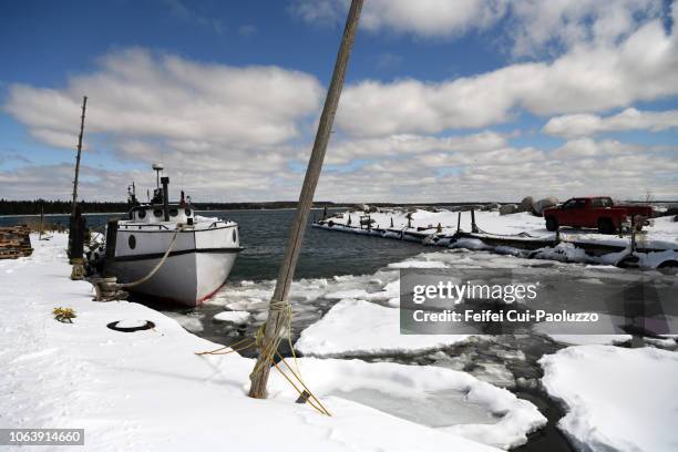 winter landscape of harbor at naubinway, michigan, usa - snow melting on car stock pictures, royalty-free photos & images