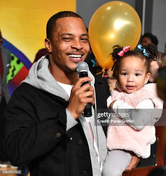 Rapper/actor T.I. And his daughter Heiress Diana Harris attend Tip "T.I." Harris' 13th annual Thanksgiving Turkey Giveaway at Adamsville Recreation...