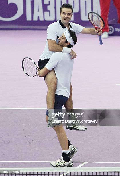 Daniele Bracciali and Potito Starace of Italy celebrate their win during final match of the International Tennis Tournamen St. Petersburg Open 2010...