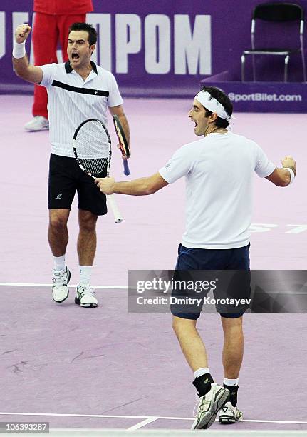 Daniele Bracciali and Potito Starace of Italy celebrate their win during final match of the International Tennis Tournamen St. Petersburg Open 2010...