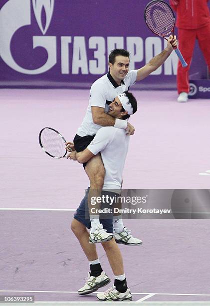 Daniele Bracciali and Potito Starace of Italy celebrate their win during final match of the International Tennis Tournamen St. Petersburg Open 2010...