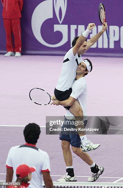 Daniele Bracciali and Potito Starace of Italy celebrate their win during final match of the International Tennis Tournamen St. Petersburg Open 2010...