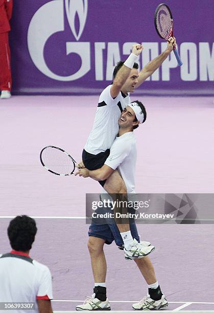 Daniele Bracciali and Potito Starace of Italy celebrate their win during final match of the International Tennis Tournamen St. Petersburg Open 2010...