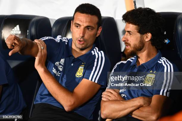 Lionel Scaloni head coach of Argentina talks with Pablo Aimar during a friendly match between Argentina and Mexico at Malvinas Argentinas Stadium on...