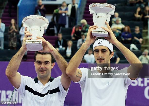 Daniele Bracciali and Potito Starace of Italy with cups after their win during final match of the International Tennis Tournamen St. Petersburg Open...