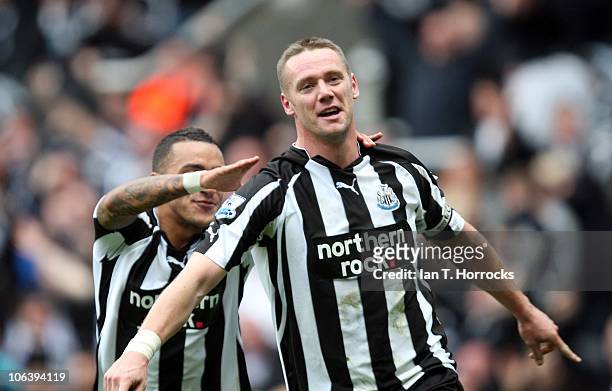 Kevin Nolan of Newcastle United celebrates with Danny Simpson after Nolan scoredthe first goal during the Barclays Premier League match between...