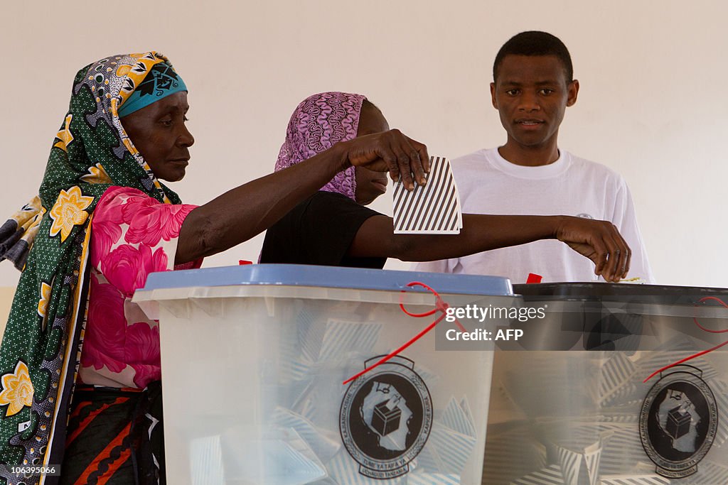 Tanzanian women cast their voting slips