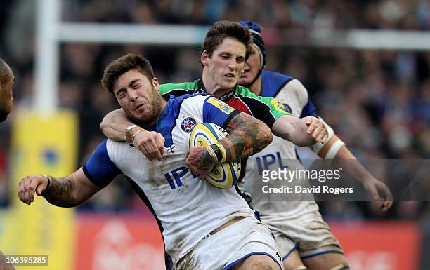 Matt Banahan of Bath is high tackled by Tom Williams during the Aviva Premiership match between Harlequins and Bath at the Stoop on October 31, 2010...